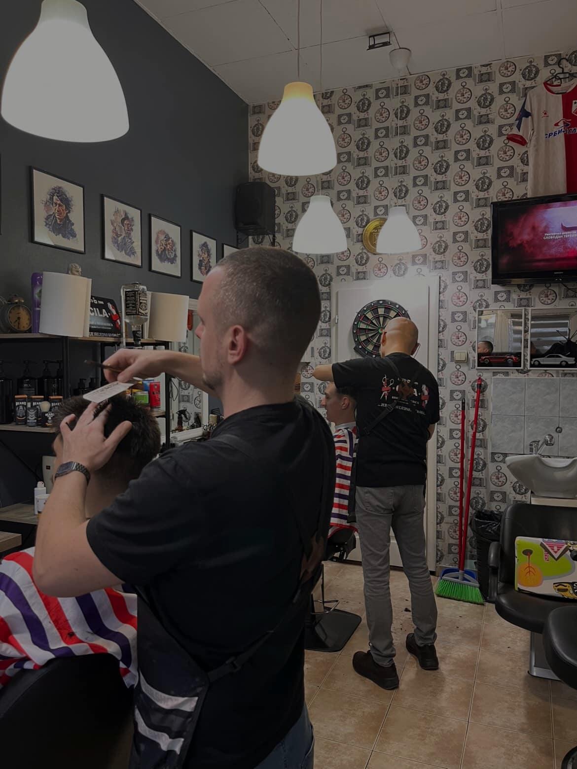 Client getting a premium shave in a barbershop